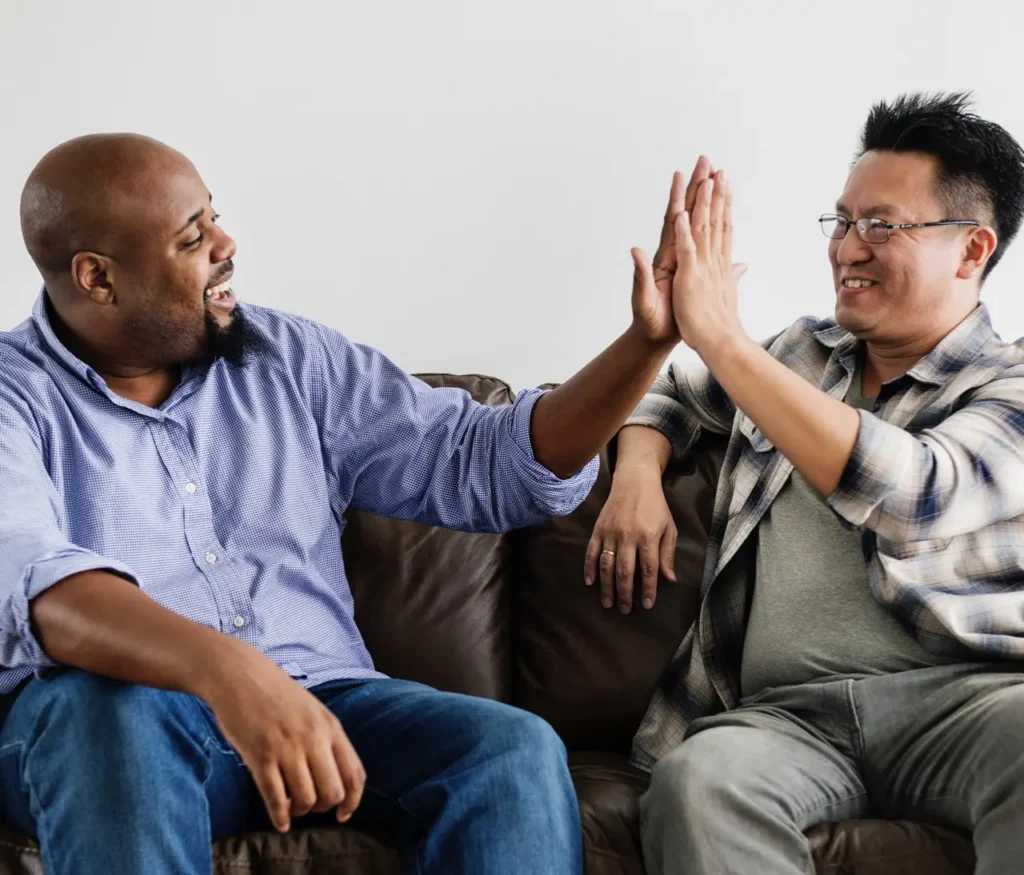 co workers doing high five 2026 01 08 05 26 33 utc Large | Voyager Recovery Center