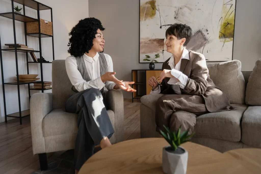 two businesswomen discussing sitting on comfortabl 2026 01 09 11 34 55 utc | Voyager Recovery Center