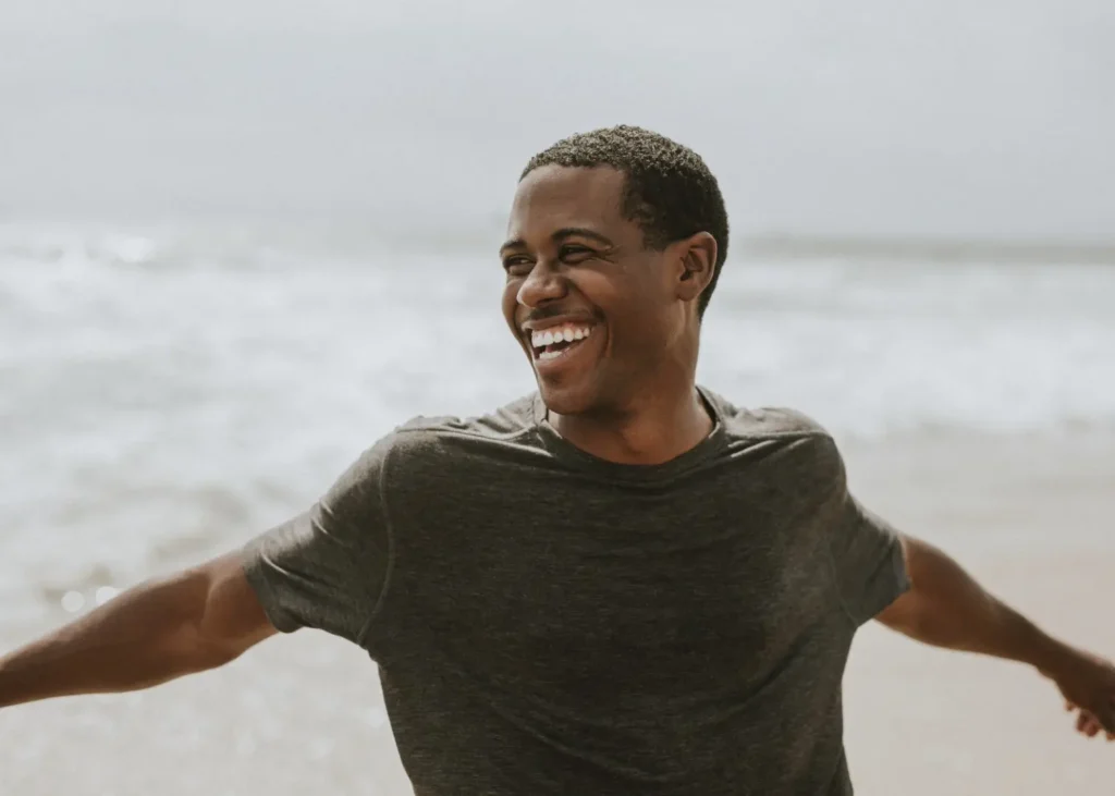cheerful man enjoying on the beach 2026 01 07 23 32 53 utc | Voyager Recovery Center
