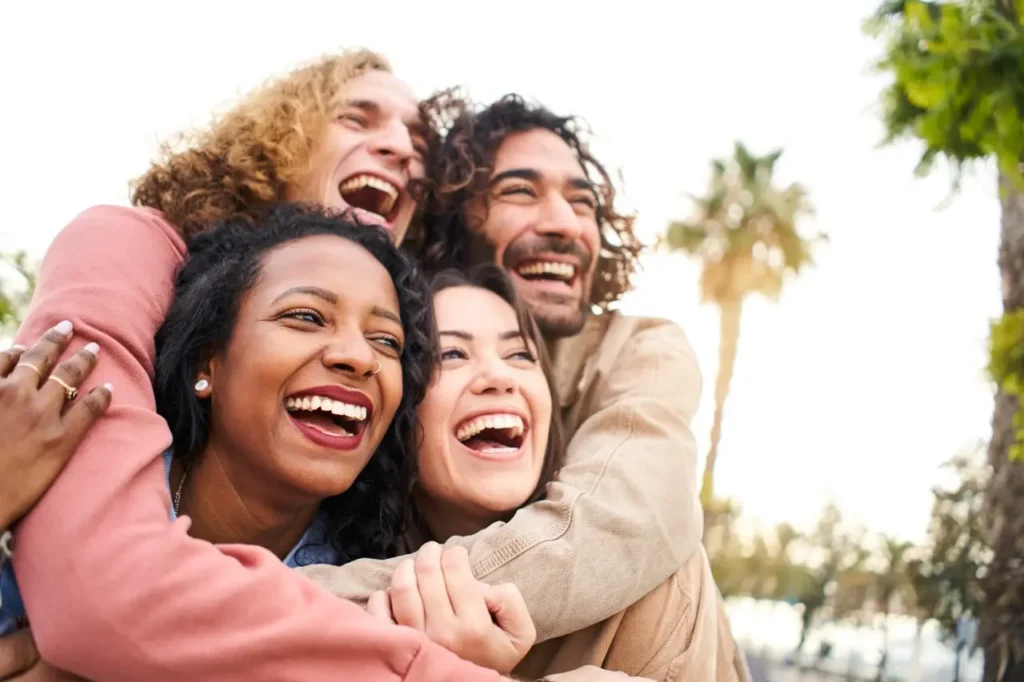 embrace people laughing young group of friends ou 2026 01 07 06 14 12 utc Large | Voyager Recovery Center
