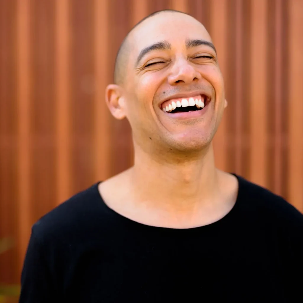 man laughing with closed eyes standing outdoors 2026 03 18 04 27 24 utc | Voyager Recovery Center