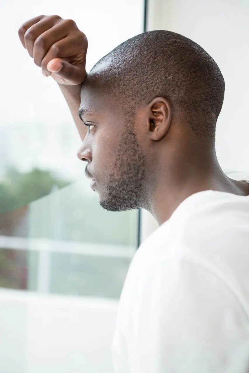 man leaning head against window looking sad 2026 03 25 00 50 47 utc Large | Voyager Recovery Center