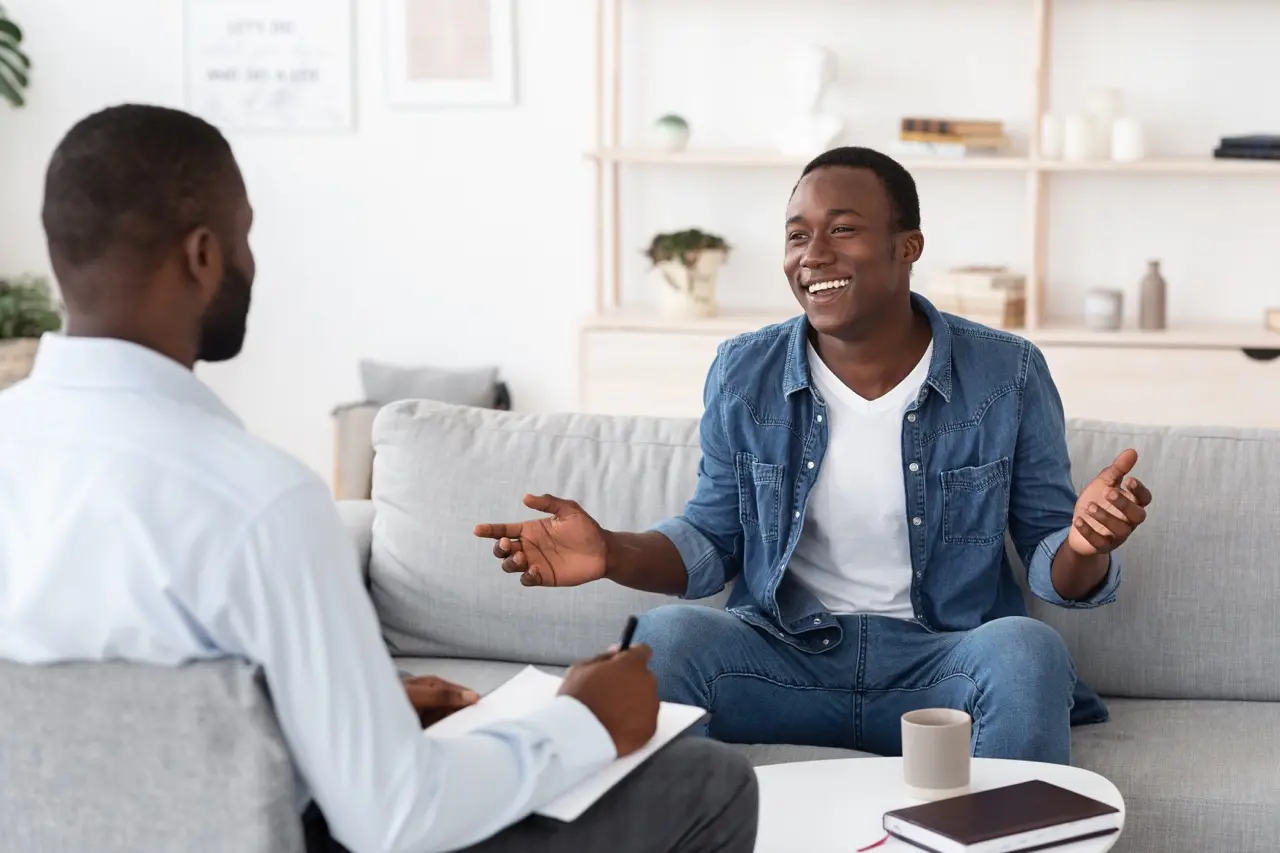 successful therapy cheerful black man talking to 2026 01 08 23 19 17 utc Large | Voyager Recovery Center