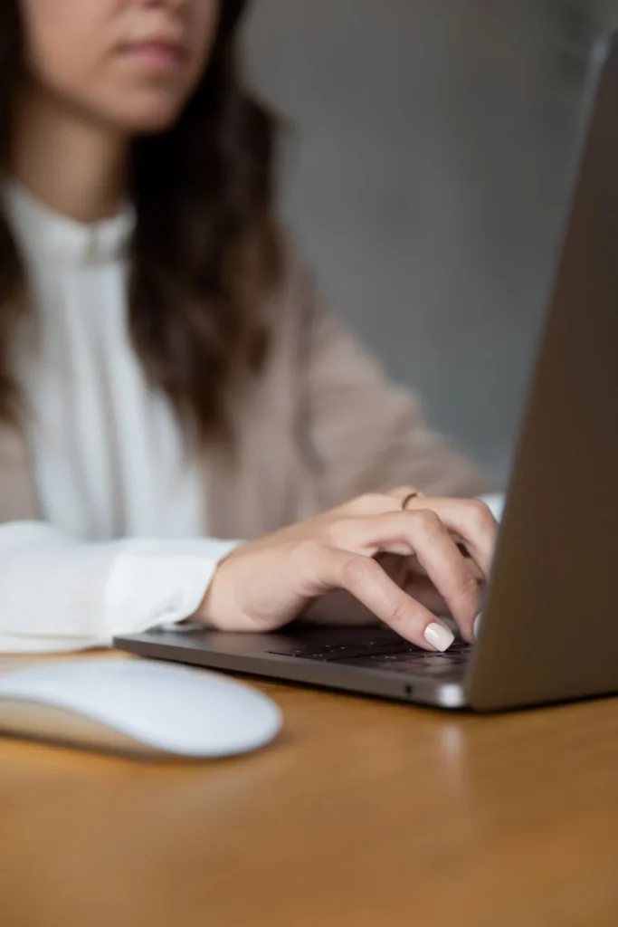 woman working on laptop at wooden desk 2026 01 09 08 41 19 utc | Voyager Recovery Center