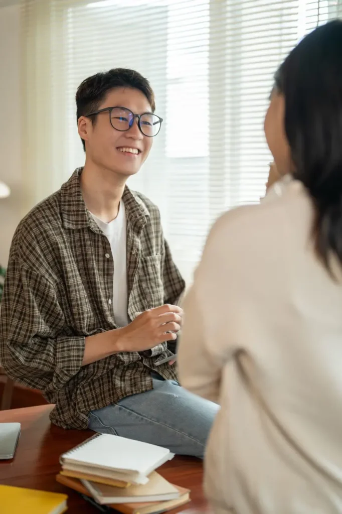 smiling young adult talking to friend indoors 2026 09 22 11 43 55 utc Large | Voyager Recovery Center
